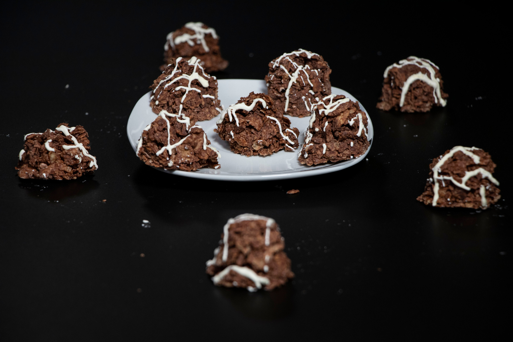 Plate with dark chocolate swarms